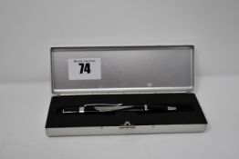 A Snap On ballpoint pen in black and silver with presentation case.