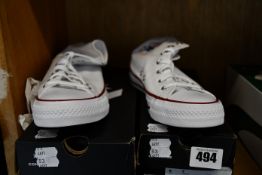 Two pairs of Converse All Stars high top trainers (UK 5 and 6.5).
