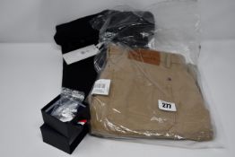 A pair of distressed Tommy Hilfiger jeans (36/34), Tommy Hilfiger cargo pants (40) and a pair of