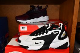 A pair of Nike Air Huarache ultra (UK 4) and a pair of women's Nike zoom 2K trainers (UK 6.5).
