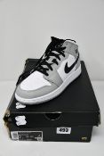A pair of as new Nike Air Jordan 1 mid GS (UK 6).