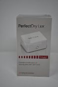 Two boxed as new PerfectDry LUX dry & disinfect Hearing Aids.