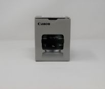 A boxed as new Canon EF 50 mm-f/1.4 USM Lens.