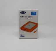 A boxed as new LaCie Rugged Thunderbolt USB-C 1TB Portable External Hard Drive (Box opened).