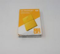 A boxed as new WD My Passport 3TB Portable Hard Drive in Yellow (Some cosmetic damage to box).