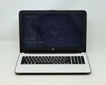 A pre-owned HP 15-af119ng laptop in white with AMD A8-7410 APU Radeon R5 Graphics 2.20 GHz, 4GB RAM,