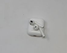 A pre-owned pair of Apple AirPods (1st Gen) with Wireless Charging Case (Some cosmetic marks).
