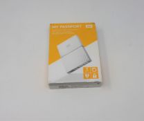A boxed as new WD My Passport 3TB Portable Hard Drive in Orange (Some cosmetic damage to box).