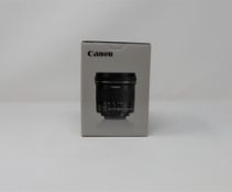 A boxed as new Canon EF-S10-18 mm f/4.5-5.6 IS STM Lens.