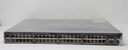 A boxed as new Cisco Catalyst 2960X-48LPS-L V06 Managed Switch (Box opened, UK power adaptor