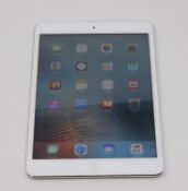 A pre owned Apple iPad mini Wifi Only/1st Gen 16GB in white, cosmetic damage to casing, faulty