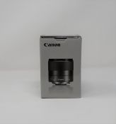 A boxed as new Canon EF-M 32mm f/1.4 STM Lens.