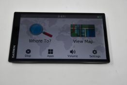 A pre-owned Garmin DriveSmart 61LMT-D 6.95 Inch Sat Nav with mount (No charger or other accessories