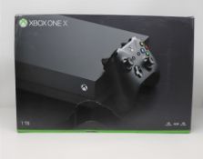 A boxed as new Xbox One X 1TB Console in Black (Model: 1787) (Box sealed, some cosmetic damage to