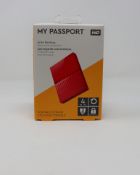A boxed as new WD My Passport 4TB Portable Hard Drive in Red.