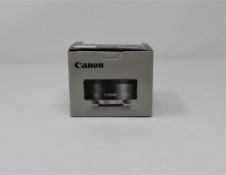 A boxed as new Canon EF-M 22mm f/2.0 STM lens.