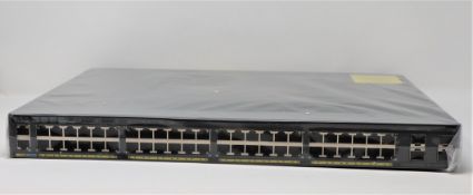 A boxed as new Cisco Catalyst 2960X-48LPS-L V06 Managed Switch (Box opened, UK power adaptor