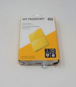 A boxed as new WD My Passport 1TB Portable Hard Drive in Yellow (Some cosmetic damage to box).