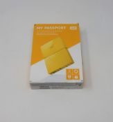 A boxed as new WD My Passport 3TB Portable Hard Drive in Yellow (Some cosmetic damage to box).