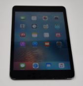 A pre owned Apple iPad mini Wifi Only/1st Gen in black, cosmetic damage to case and screen (