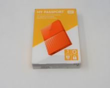 A boxed as new WD My Passport 3TB Portable Hard Drive in White (Some cosmetic damage to box).