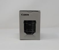 A boxed as new Canon EF-S10-18 mm f/4.5-5.6 IS STM Lens.