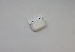 A pre-owned pair of Apple AirPods Pro with Wireless Charging Case (Model: A2084).