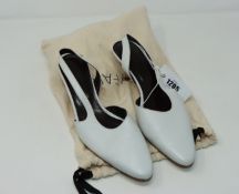 One pre-owned By Far white leather slingback shoes size 39.