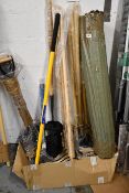 A quantity of garden related tools to include spades, digging hoes and brushes.