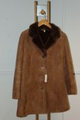 A lady's pre-owned Owen Barry suede/sheepskin coat (14 - Good condition).