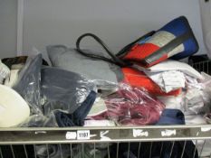 A large quantity of as new clothing and related items to include socks, shirts and bags.