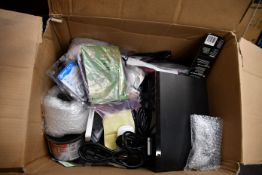 A box of assorted new and pre-owned small electrical items and accessories.