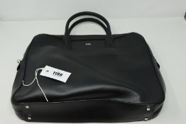 One pre-owned Furla black bag (Approximate dimensions 36x30x6 cm).