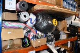 A large quantity of miscellaneous sport related items to include yoga mats, punch bag and Wilson