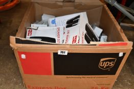 A box of assorted as new and pre-owned small electrical items and accessories.