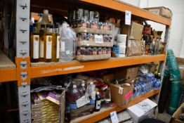 A quantity of assorted food items and beverages.