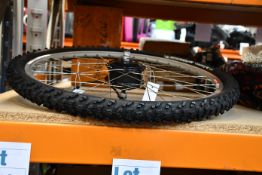 One as new Ebike wheel (TBK-100SX front hub motor, Alex Rims ACE 18 rim and Michelin Country Style