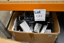 A box of assorted as new and pre-owned small electrical items and accessories.