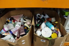 Two boxes of miscellaneous part used cosmetics, toiletries and related items.