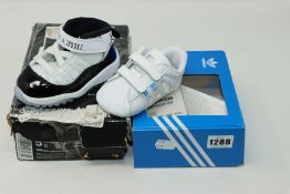 One baby's as new Nike Jordan 11 retro (td) size UK 4.5 (378040 100). One baby's as new Adidas white