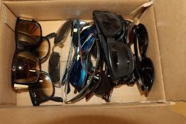 Eleven pairs of branded sunglasses.