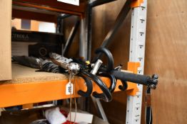 Five umbrellas, three walking sticks and two pole stands.