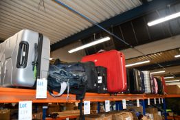 A quantity of preowned suitcases, bags and related items.