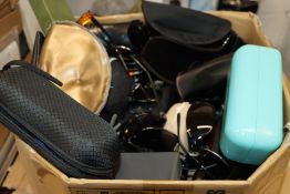 A box of branded/unbranded sunglasses.