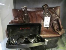 A pair of pre-owned Ralph Lauren sunglasses together with a pre-owned DKNY leather bag.