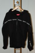 One pre-owned Supreme zip up black hoodie size M.