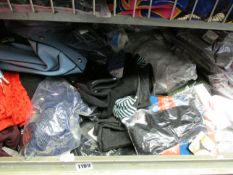 A large assortment of as new clothing and related items to include knitwear, t-shirts and socks.