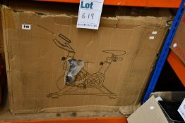 A boxed home exercise/fitness spin bike.