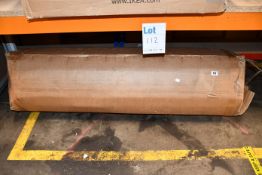 One rolled up double bed mattress.