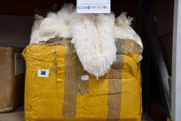 A large quantity of cushion covers in various colours and sizes.